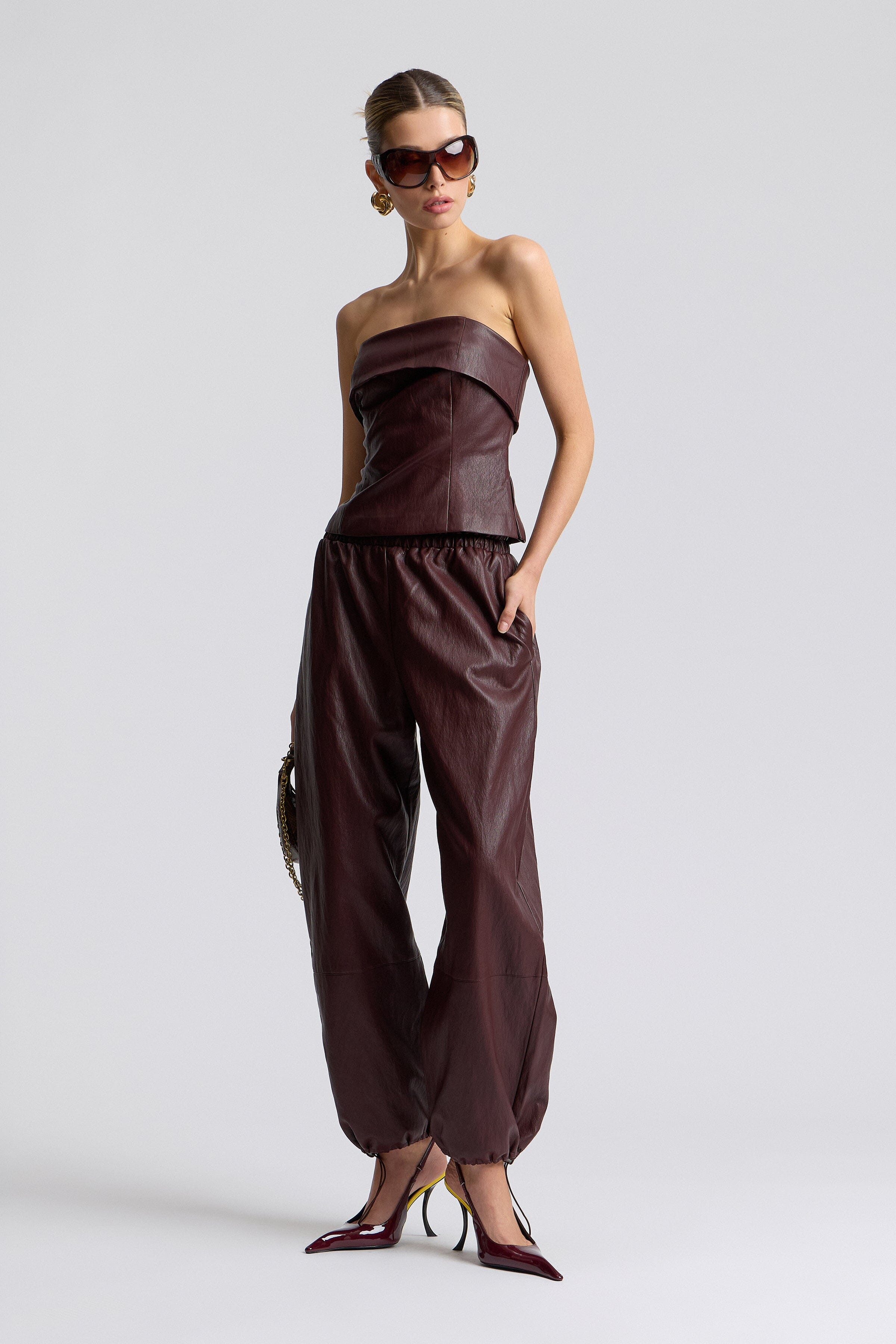 Dark brown faux leather tube top with side slits and faux leather jogger - Shop women's tops  &pants by Avec Les Filles.