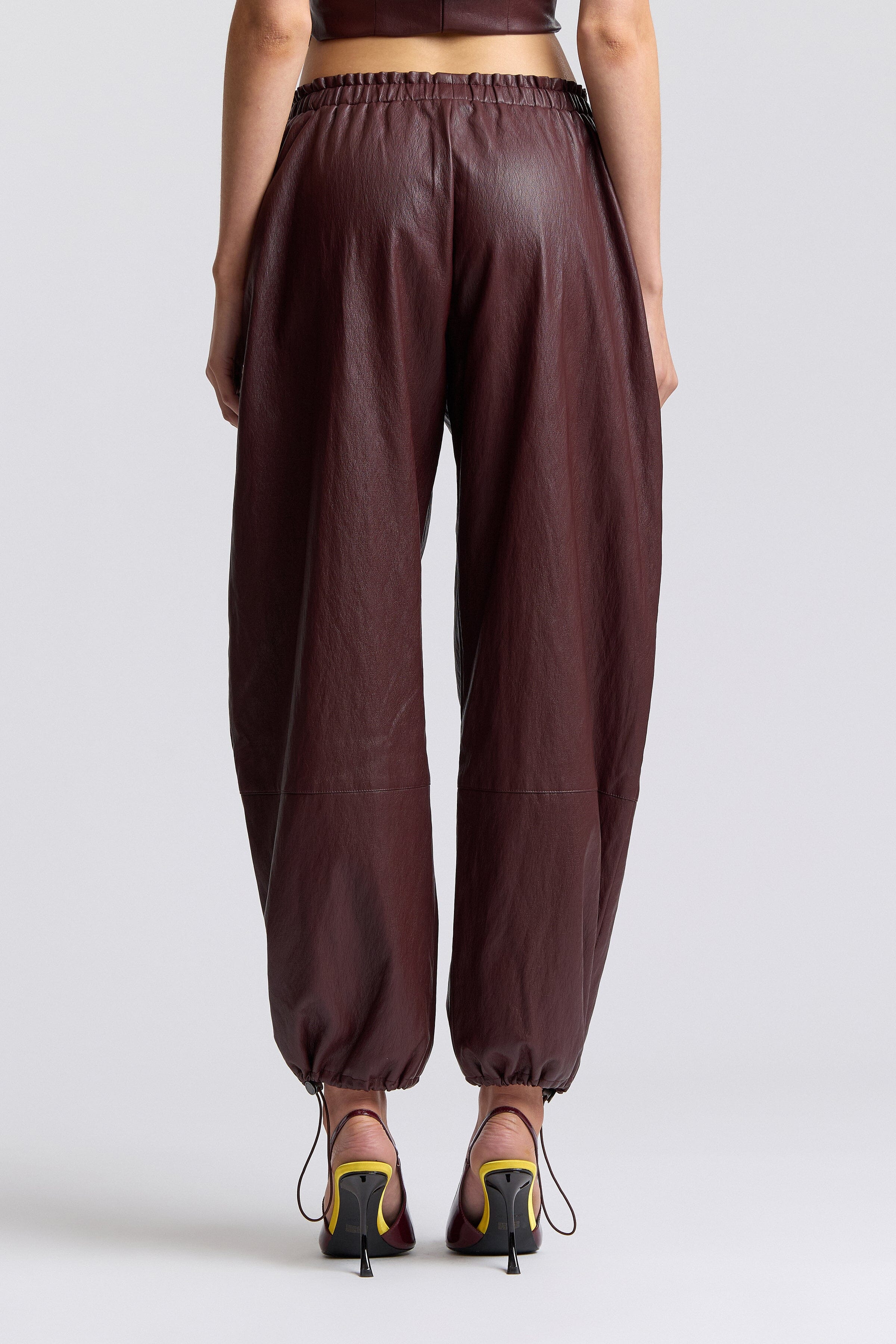 Brown faux leather joggers with an elastic waistband and mid-rise - Shop faux leather pants women by Avec Les Filles.