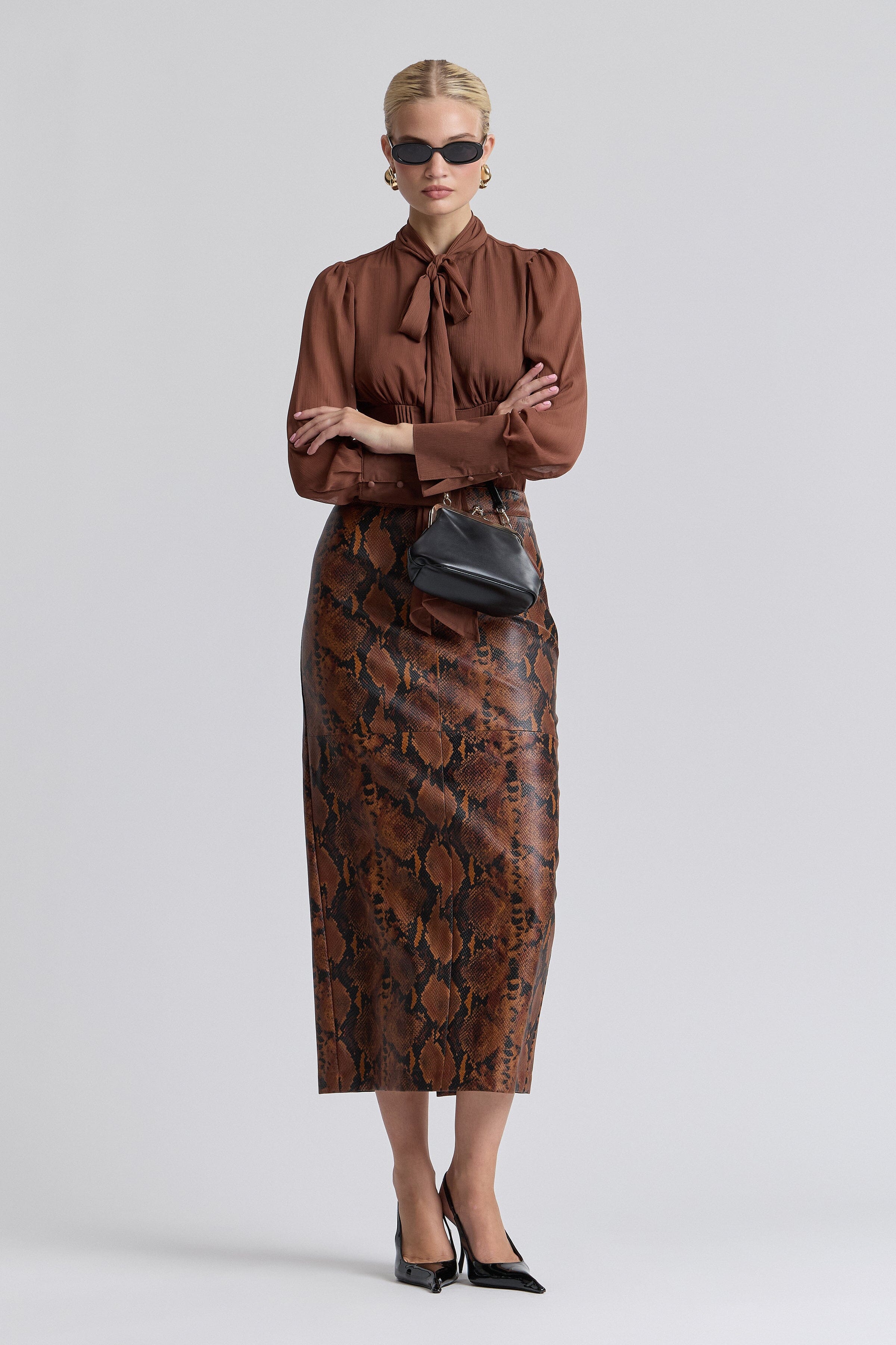 Brown snake print faux leather skirt with a structured waistband - Shop designer women's maxi skirts by Avec Les Filles.