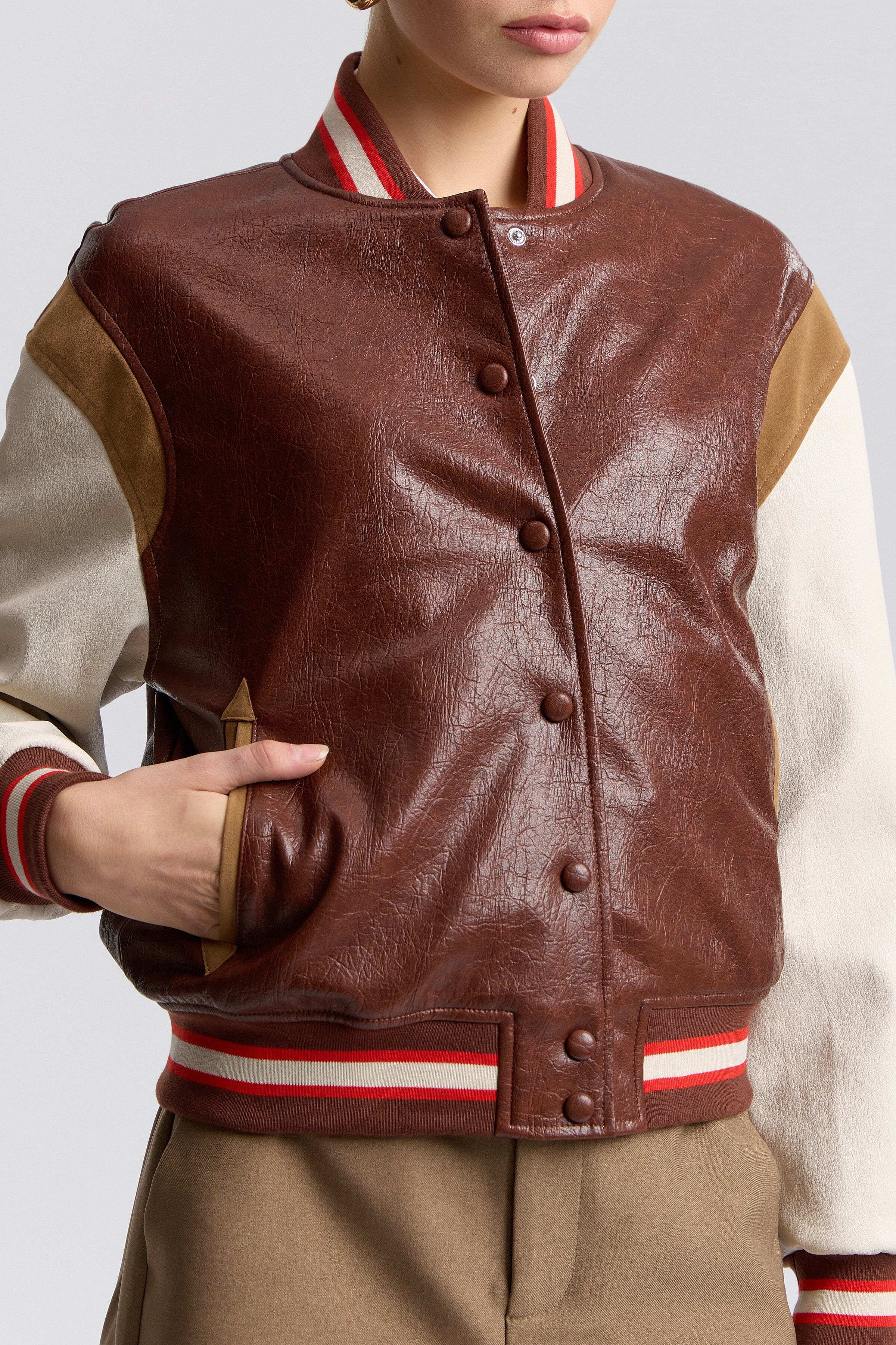 Faux-leather ladies varsity jacket with a snap-button front and long sleeves - Shop cute varsity jackets by Avec Les Filles.