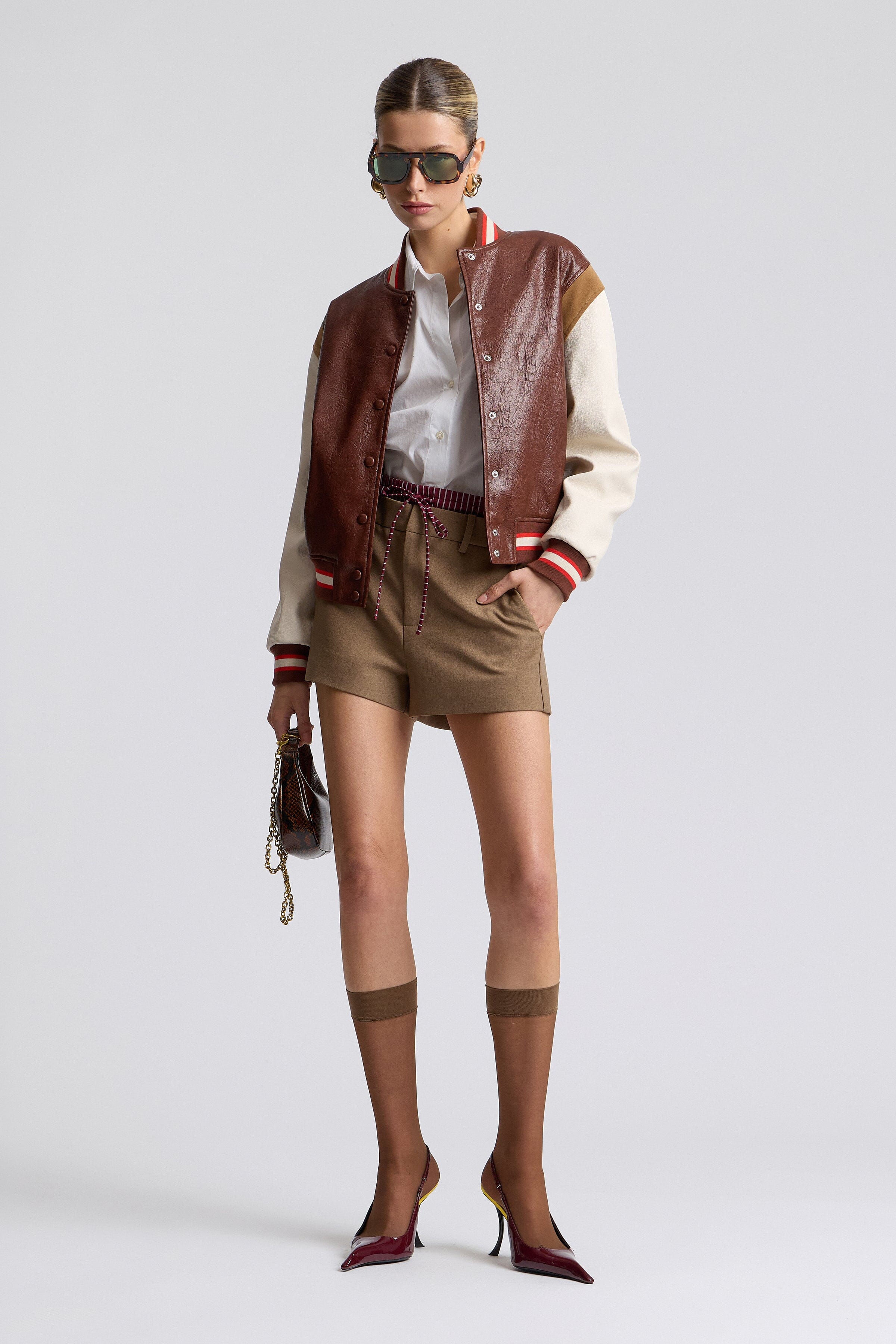 Faux-leather red varsity jacket with a snap-button front and long sleeves - Shop cute varsity jackets by Avec Les Filles.