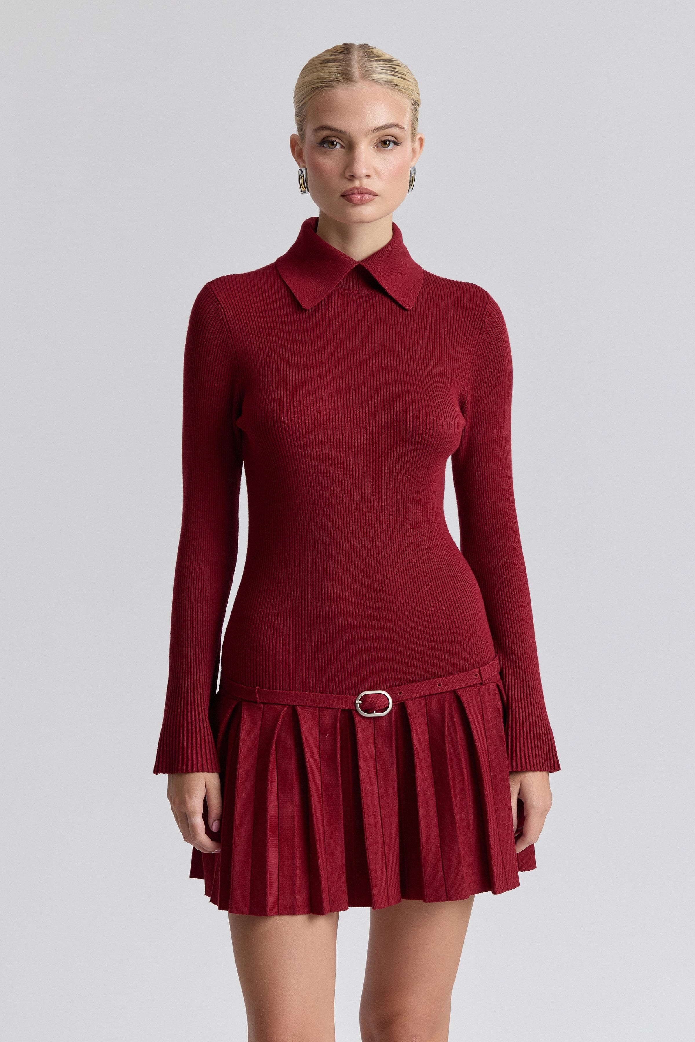 Drop-waist pleated mini red sweater dress with an adjustable belt and long sleeves by Avec Les Filles.