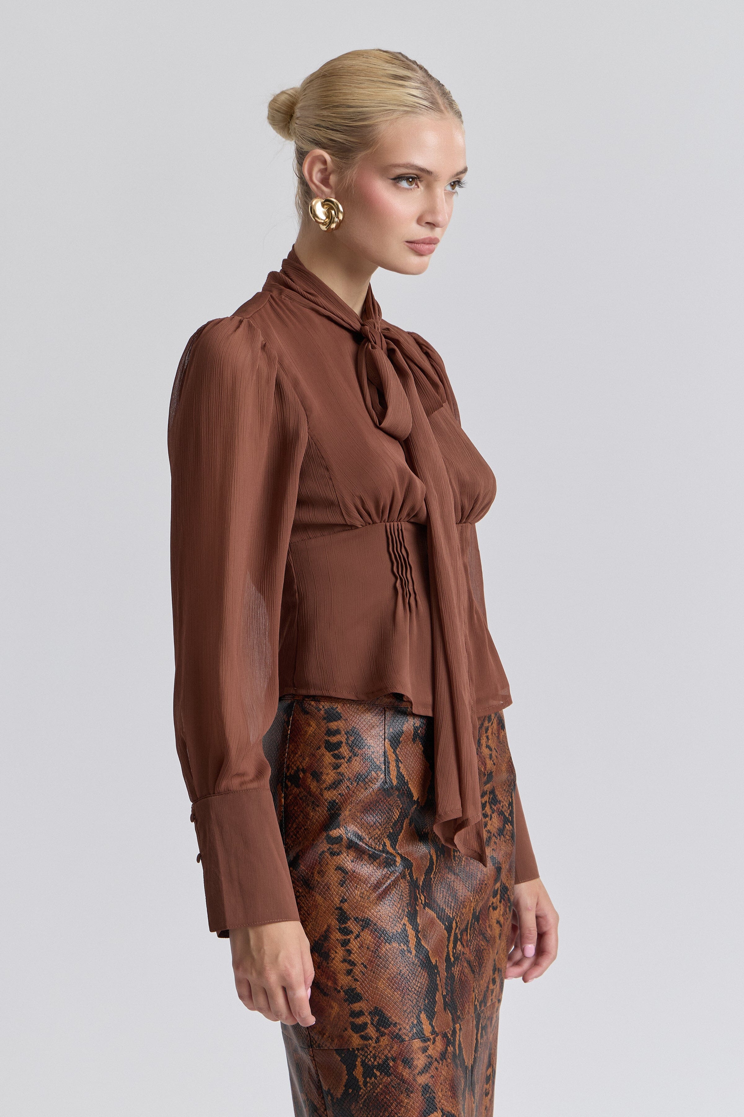 Chiffon brown blouse with tie neck with a faux-button front. Shop women's cute tops by Avec Les Filles.