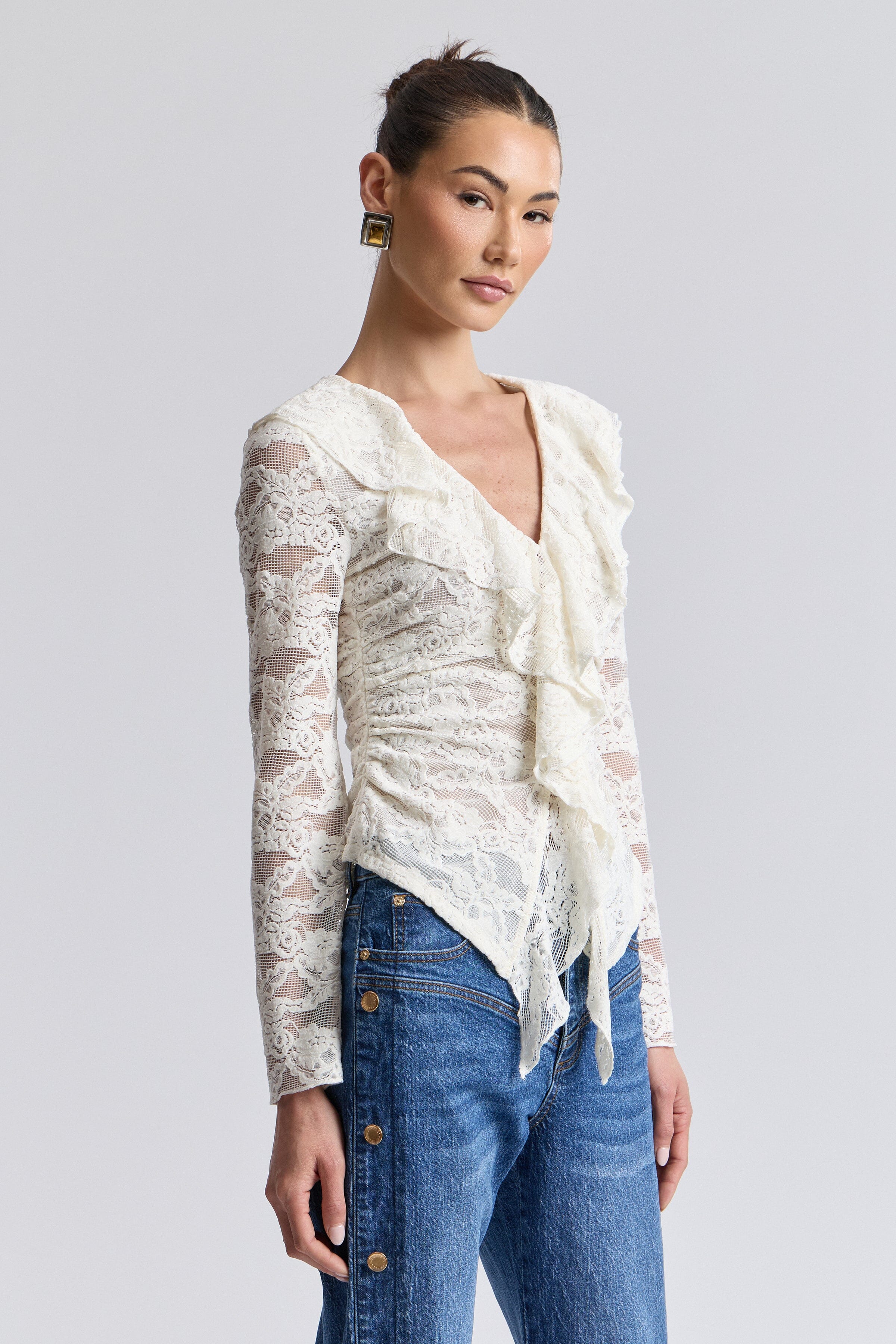 Ruffle front off white lace shirt with deep V-neckline and long sleeves. Shop cute ruffle tops for women by Avec Les Filles.