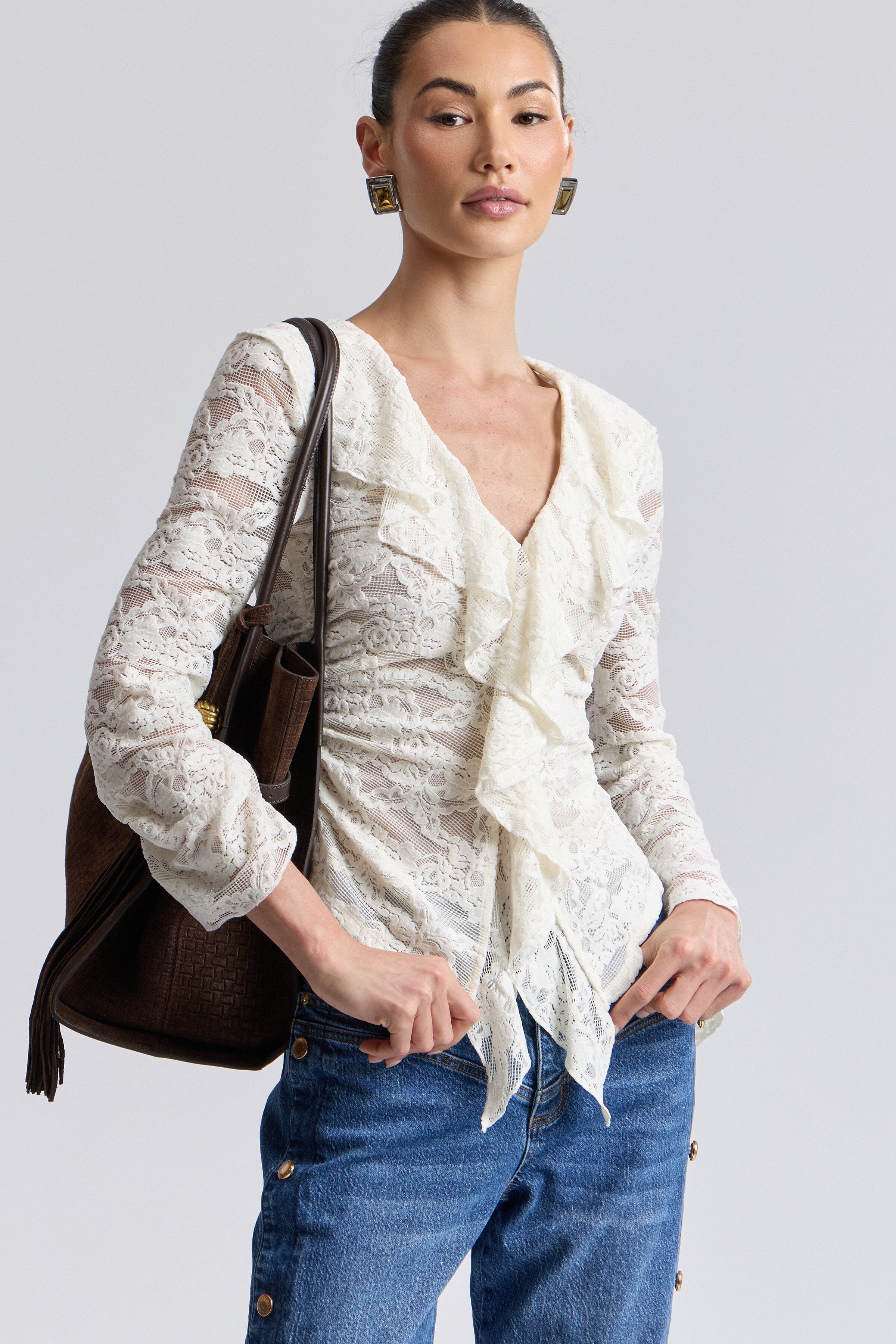 Ruffle front off white lace blouse with deep V-neckline and long sleeves. Shop cute ruffle tops by Avec Les Filles.