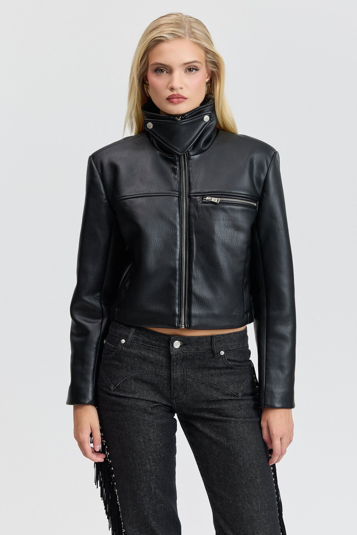 Black cropped leather jacket with a high stand collar and a front zipper. Shop women's crop jackets by Avec Les Filles.