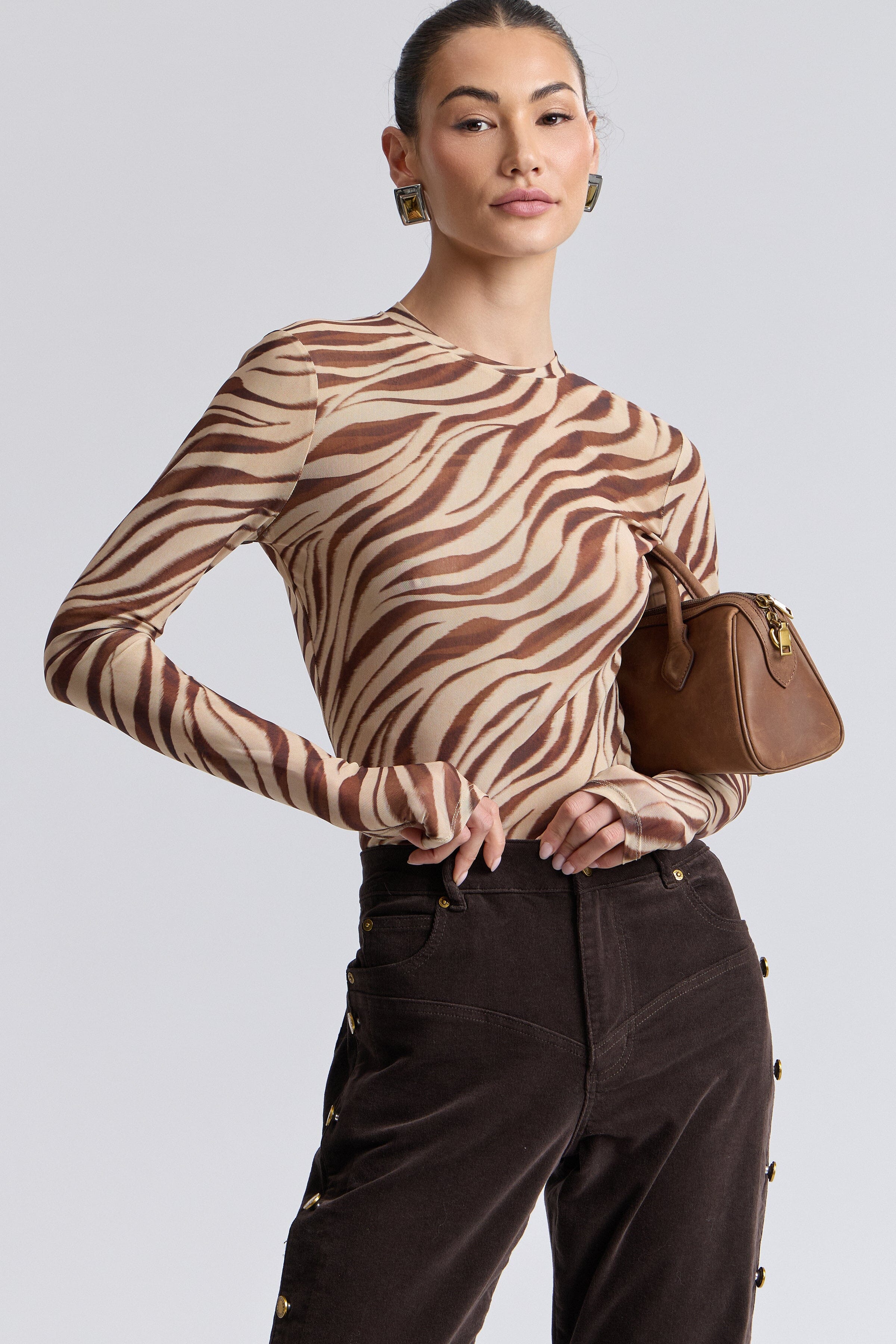 Straight-leg corduroy brown pants with mid-rise. Shop best corduroy pants for women by Avec Les Filles.