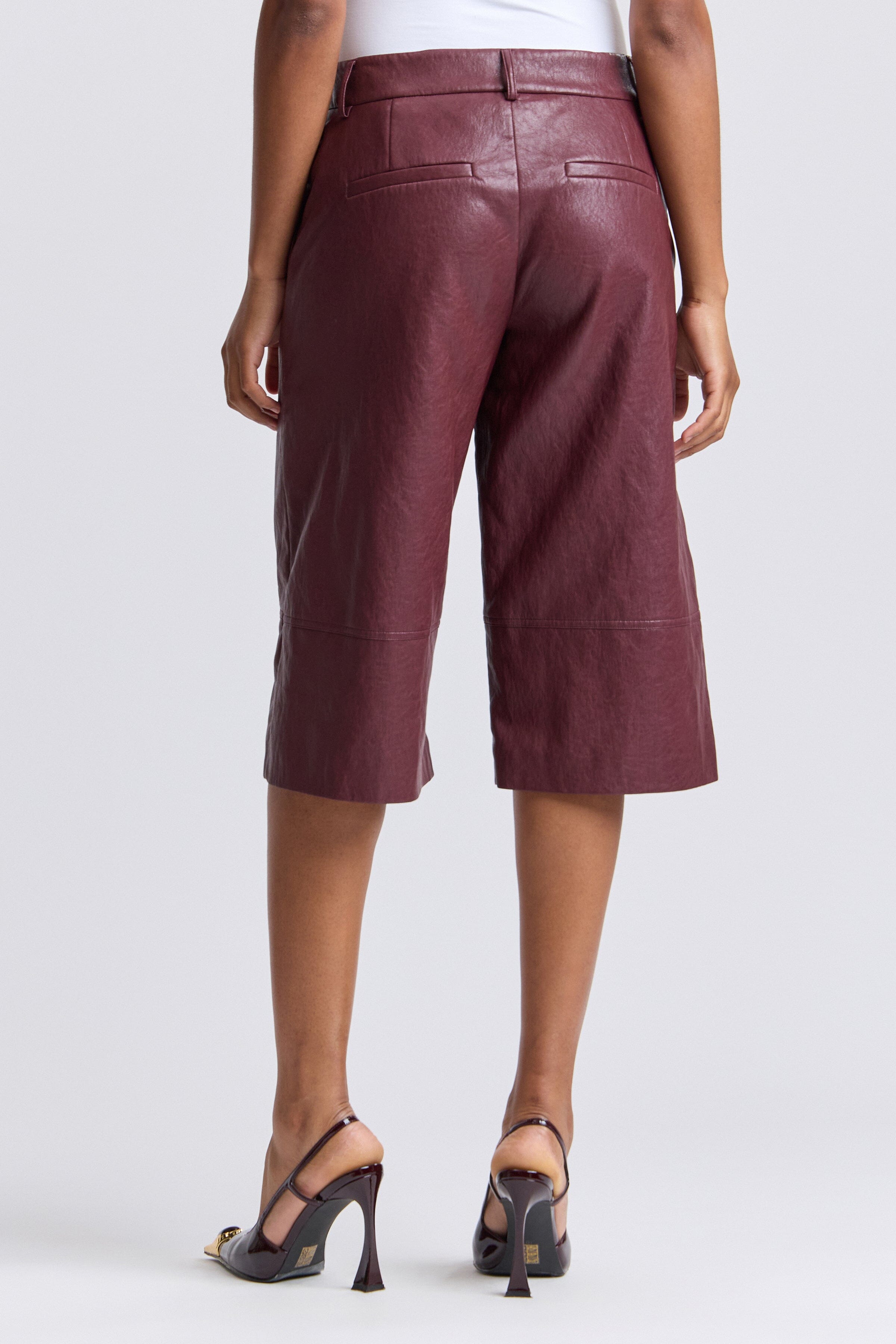 Wide-leg deep burgundy faux leather culotte shorts knee length - Shop women's pants by Avec Les Filles.