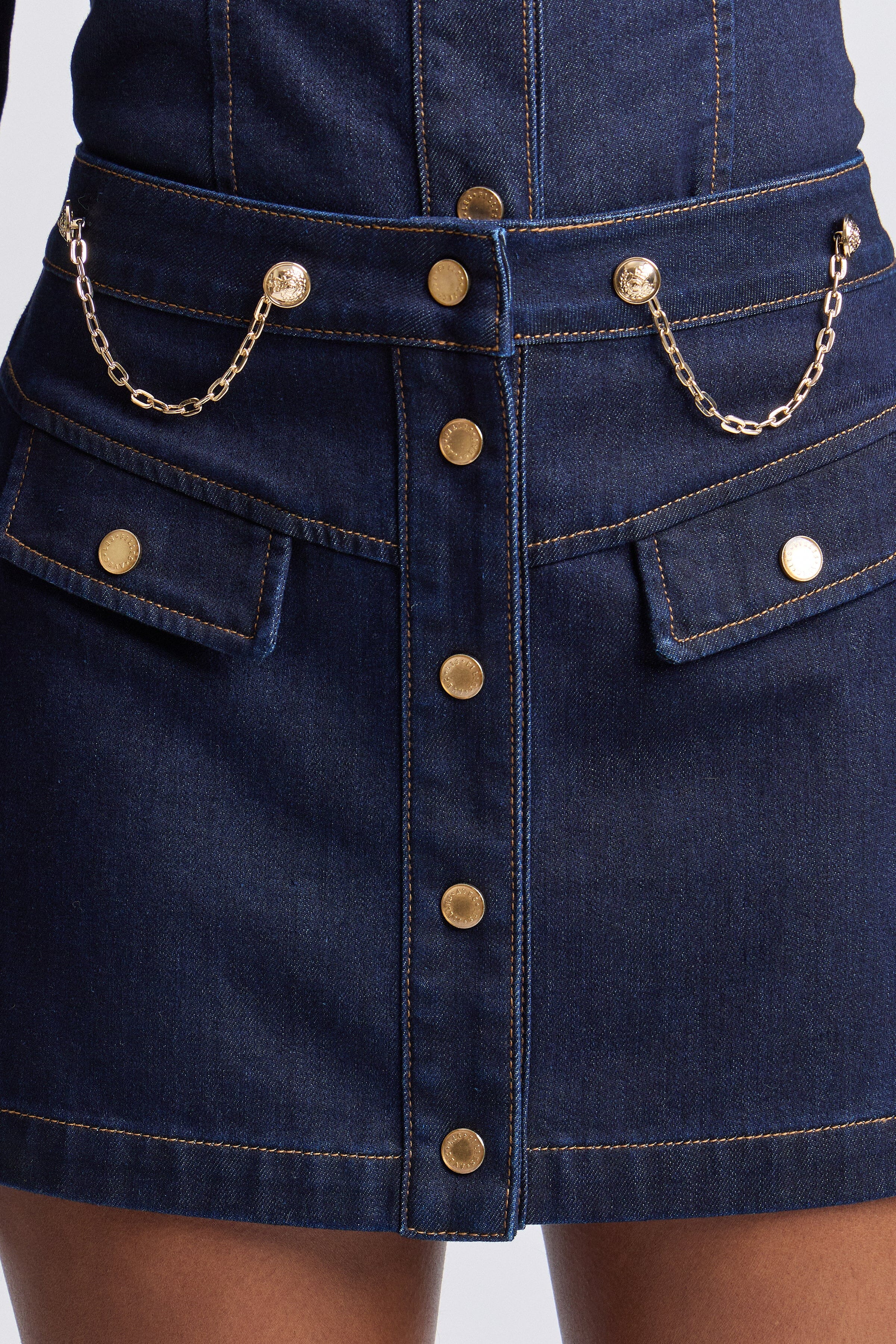 Dark indigo short skirt denim with high-rise and flap pockets - Shop women's cute denim mini skirts by Avec Les Filles.