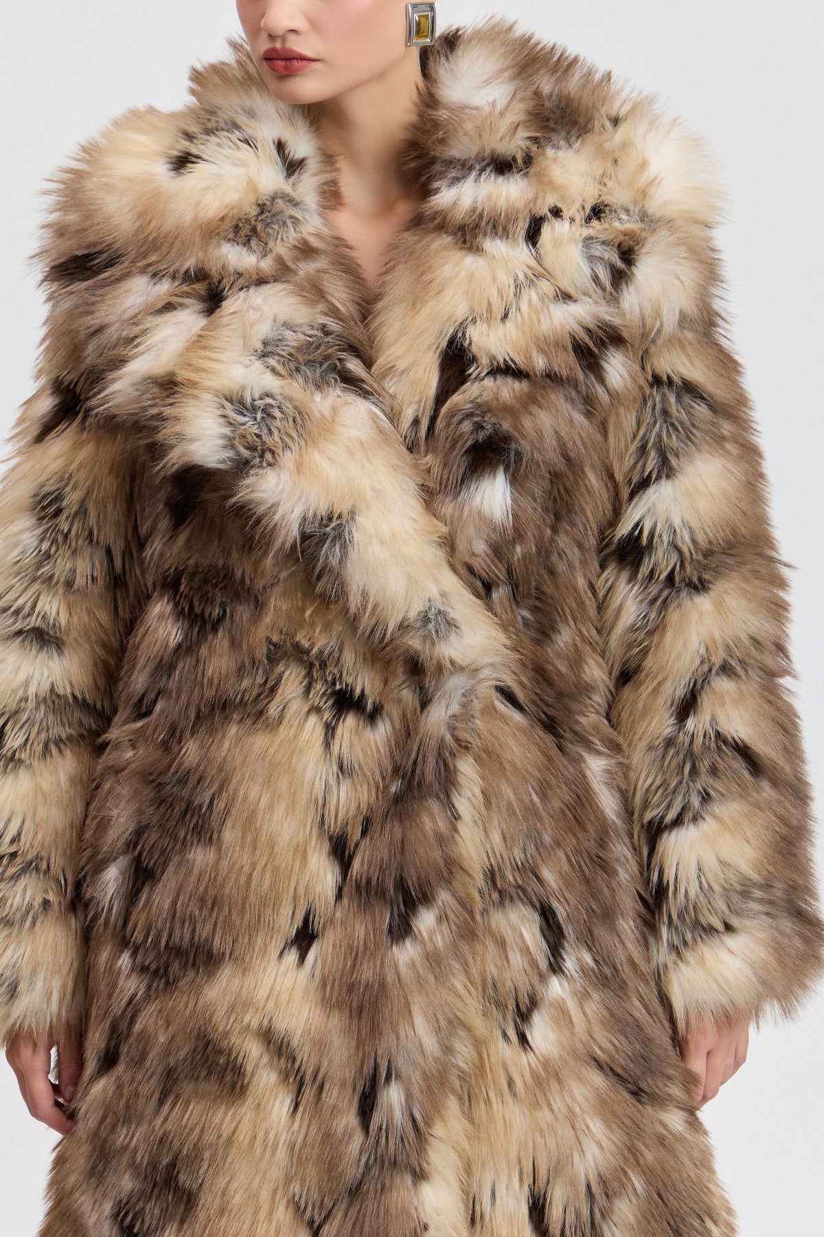 Brown long faux fur coat with side slits and a wide collar. Shop women's cute tan fur coats by Avec Les Filles.