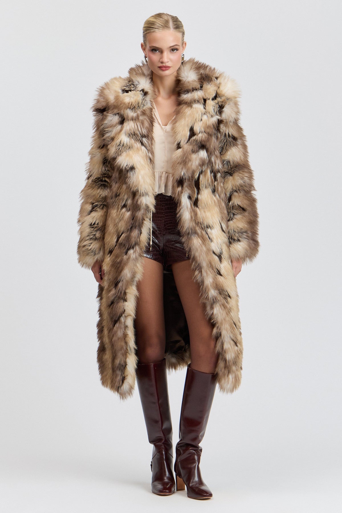 Brown long faux fur coat with side slits and a wide collar. Shop women's cute tan fur coats by Avec Les Filles.