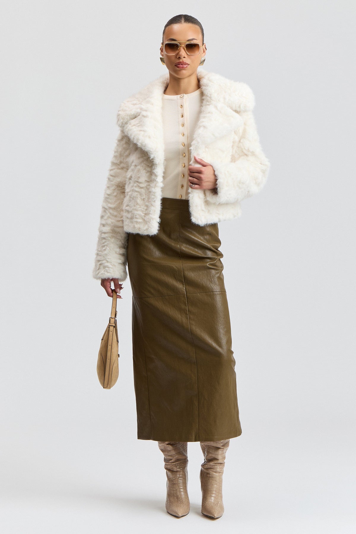 White short faux fur jacket with a center-front and oversized collar. Shop women's cute white fur jackets by Avec Les Filles.