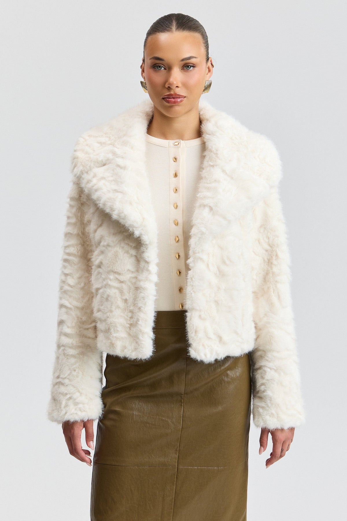 White faux fur coat jacket with a center-front and notched collar. Shop women's cute white fur jackets by Avec Les Filles.