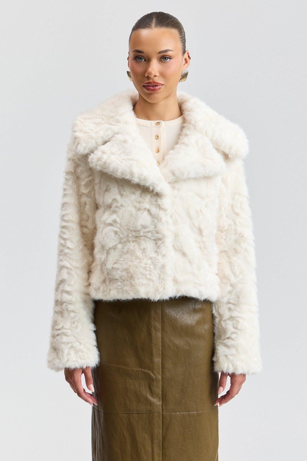 White faux fur coat with a center-front and wide collar. Shop designer women's cute white fur jackets by Avec Les Filles.