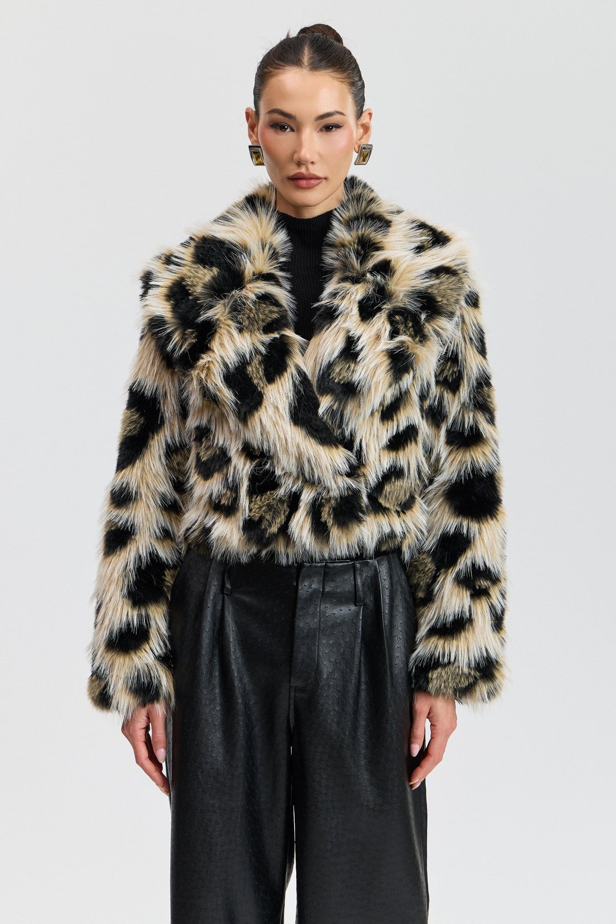 Faux fur double-breasted leopard print jacket with a button front. Shop women's cute cropped jackets by Avec Les Filles.