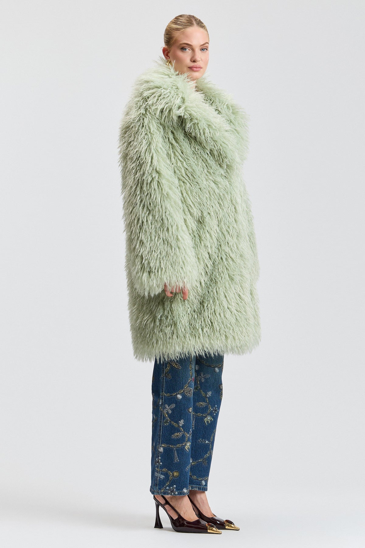 Shaggy green faux fur coat with a center front. Shop designer women's cute green fur coats by Avec Les Filles.