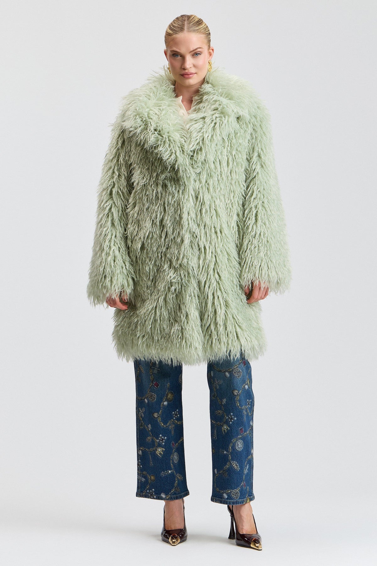 Notch-collar shaggy green fur jacket with a center front. Shop designer women's cute green fur coats by Avec Les Filles.