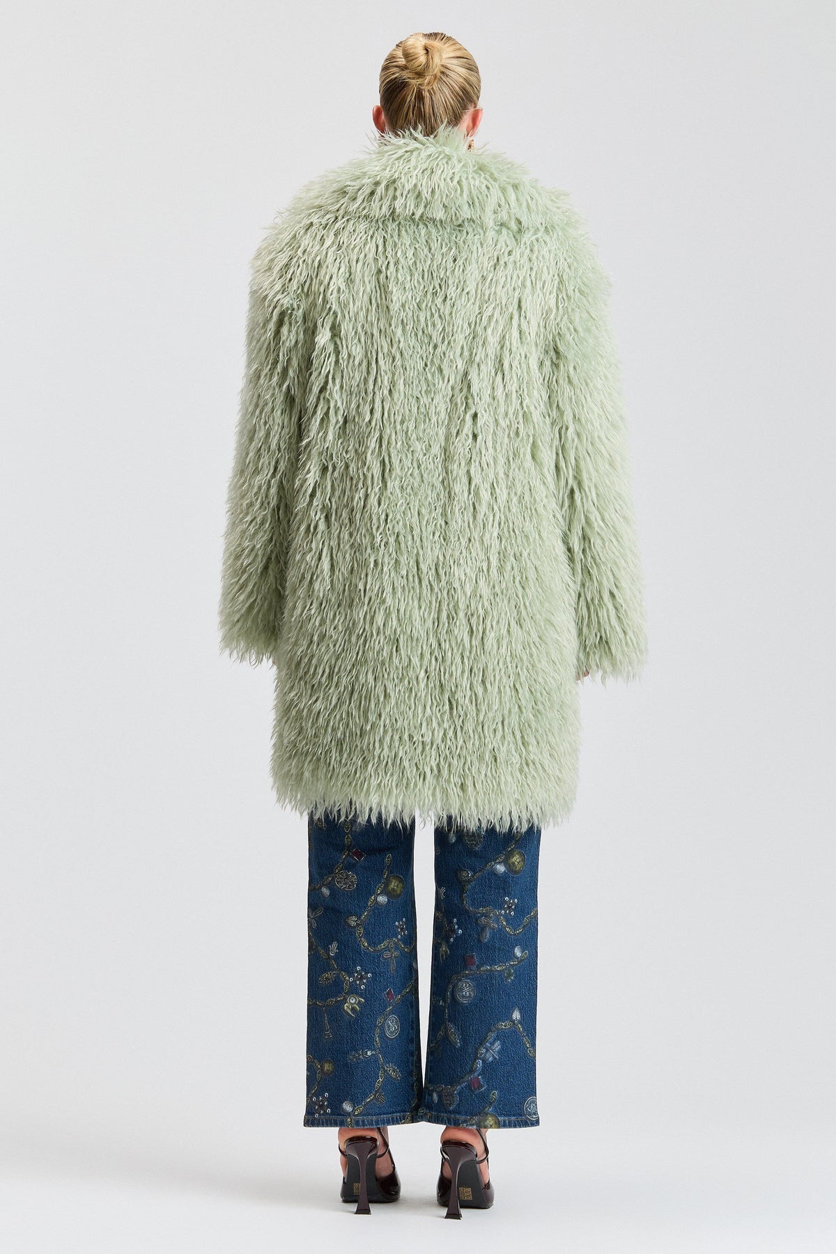 Shaggy green faux fur coat with a center front. Shop designer women's cute green fur coats by Avec Les Filles.