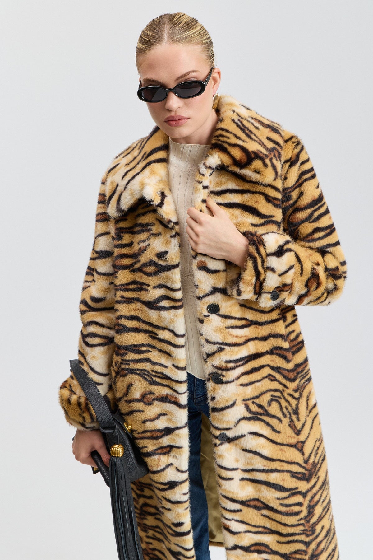 Fake fur animal print coats with a button front and pointed collar - Shop women's faux fur jackets by Avec Les Filles.