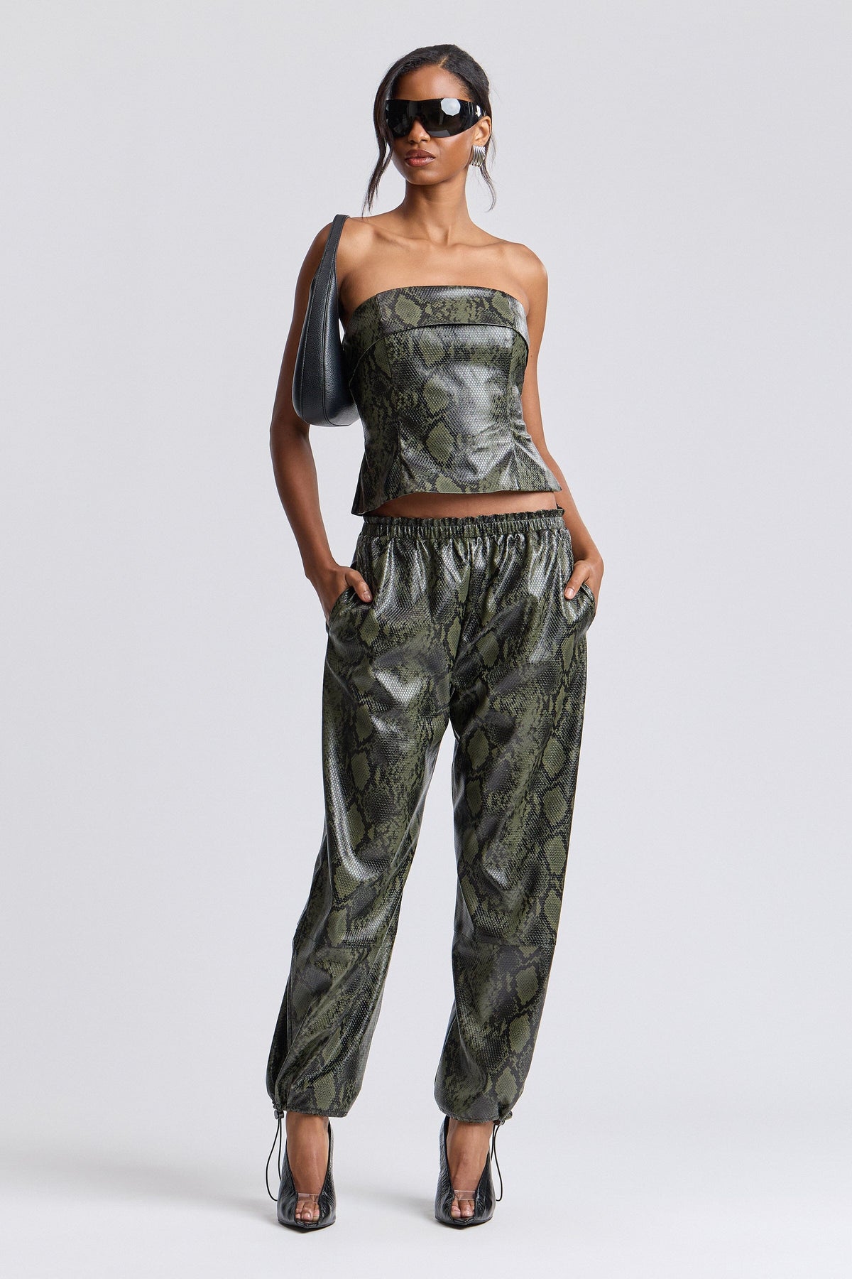 Green faux leather jogger pants with an adjustable drawcord - Shop women's faux leather pants by Avec Les Filles.