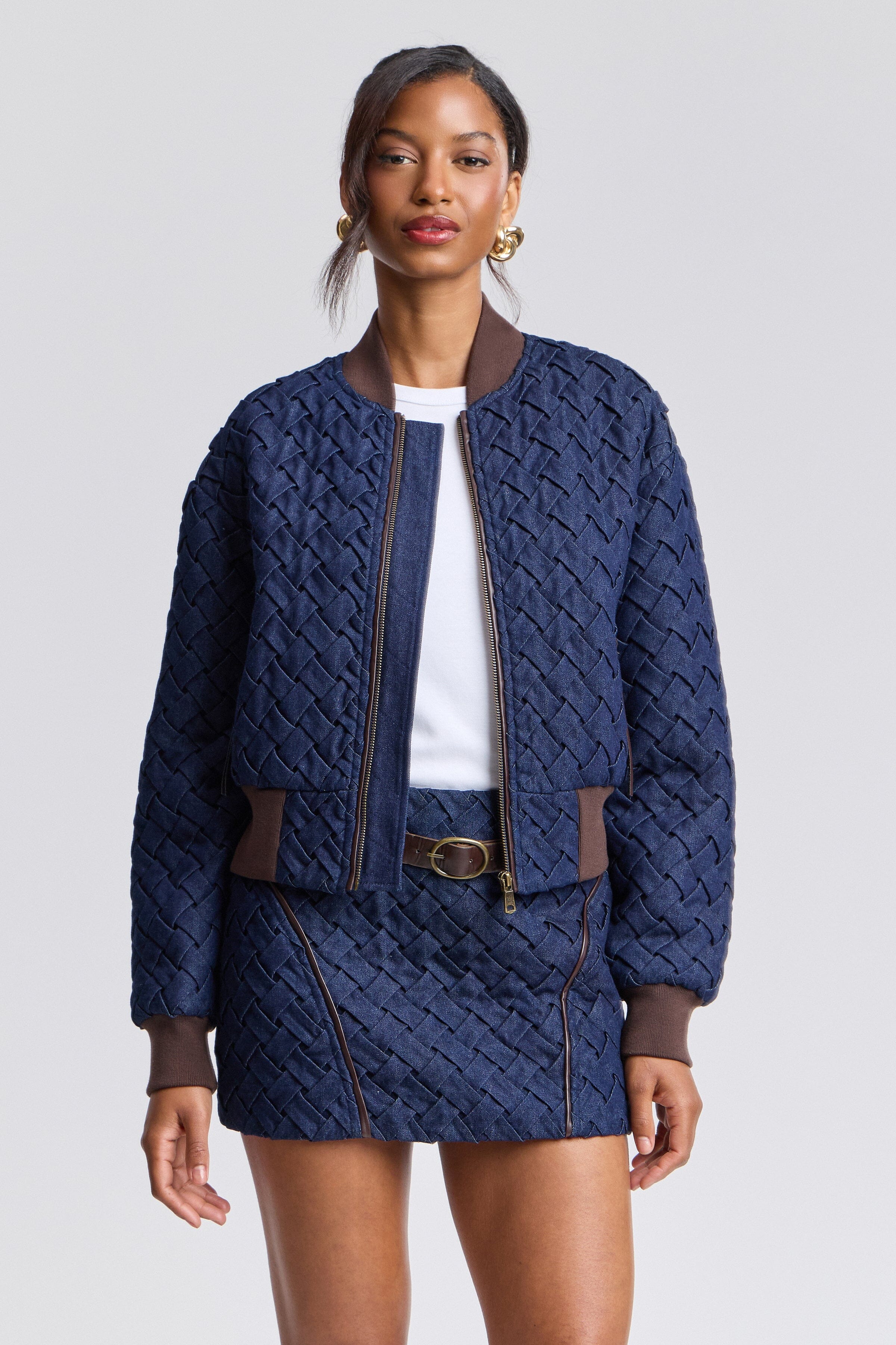Woven indigo blue denim bomber jacket with zip-front and long blouson sleeves by Avec Les Filles. 