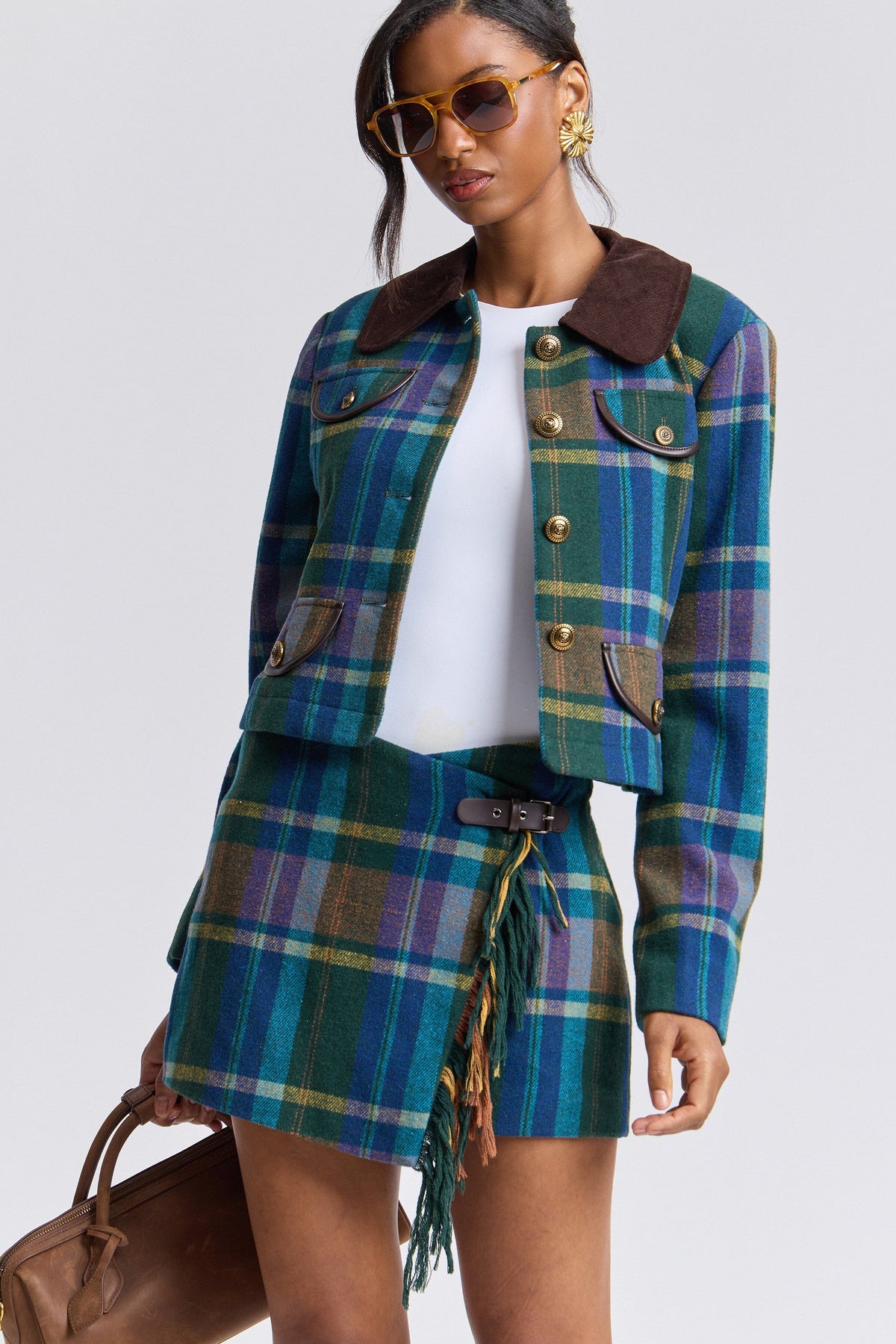 Asymmetrical waist green multi plaid mini skirt with plaid jacket and a brown faux leather belt by Avec Les Filles.