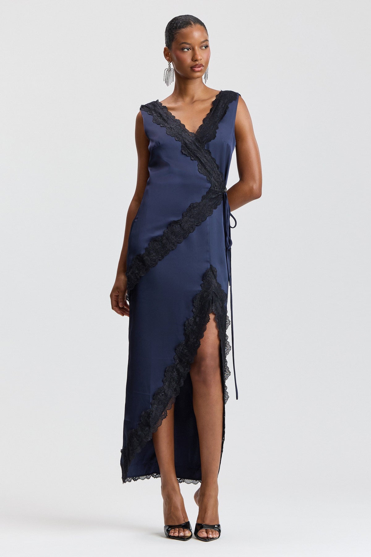 Navy blue satin wrap dress with a deep V-neck and drawstring tie waist. Shop satin maxi dresses by Avec Les Filles.
