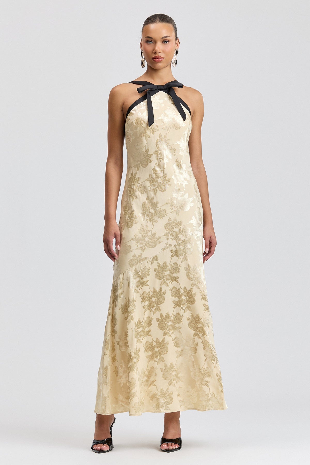 Jacquard cream halter maxi dress with black satin straps and a bow neck. Shop cute backless dresses by Avec Les Filles.