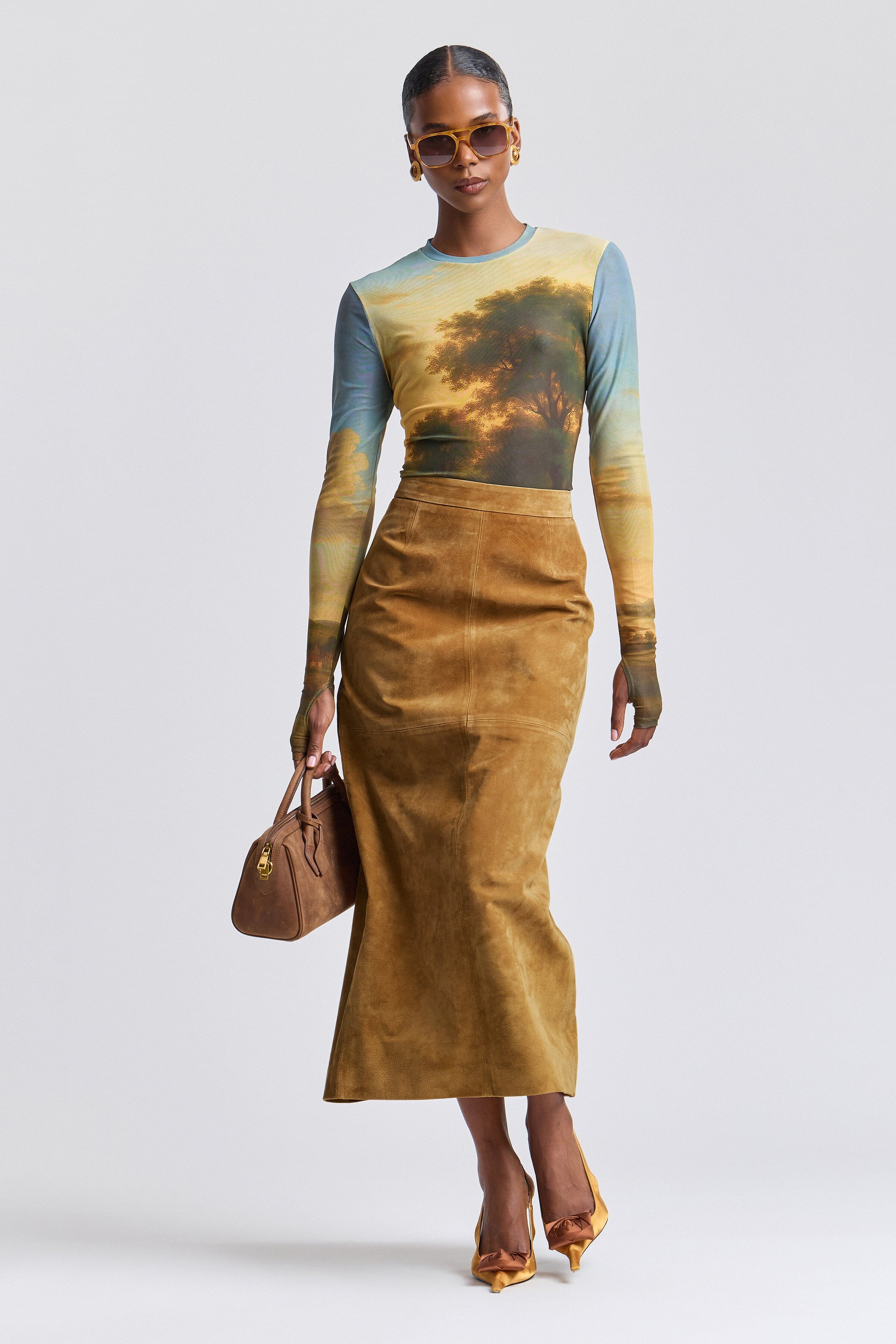 Brown fitted faux suede maxi skirt with a high waist and a back slit - Shop designer women's long maxi pencil skirts by Avec Les Filles.
