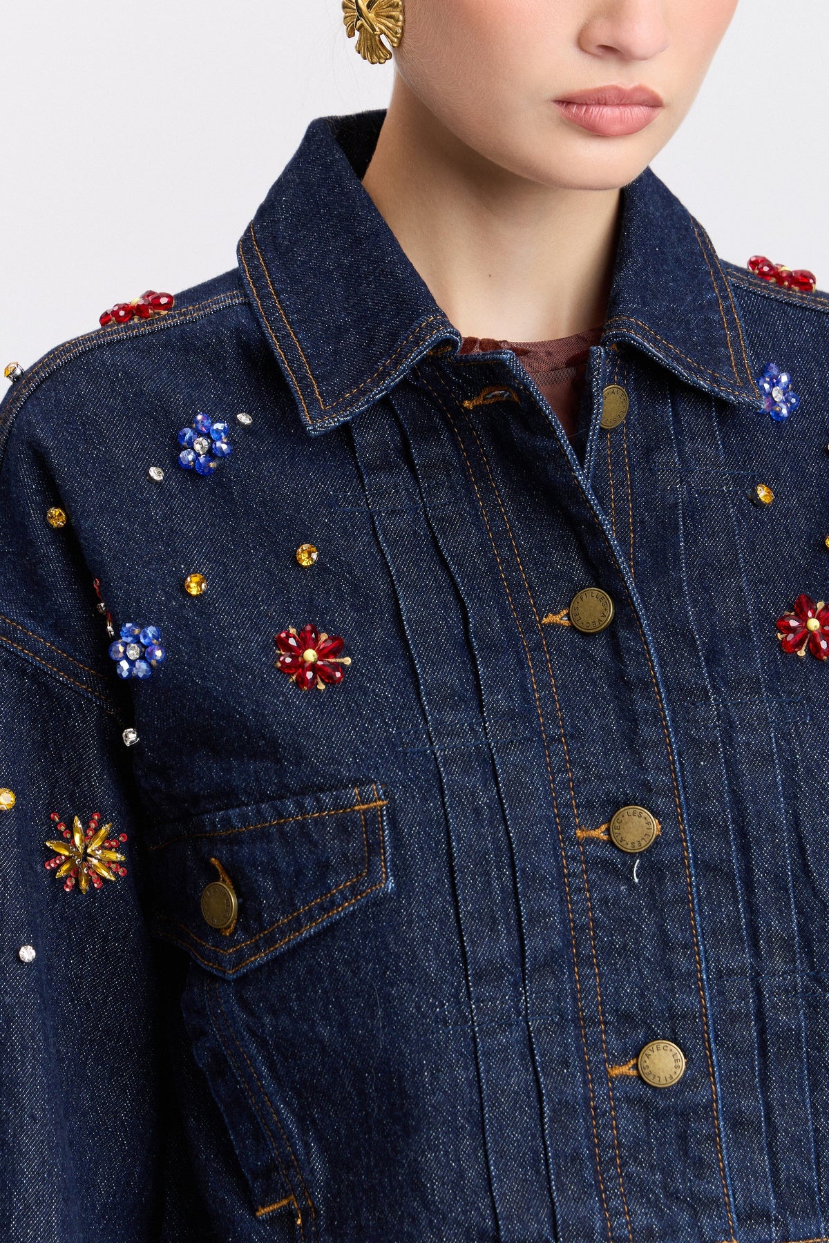 Dark blue denim rhinestone cropped jacket with point collar and button-front by Avec Les Filles.