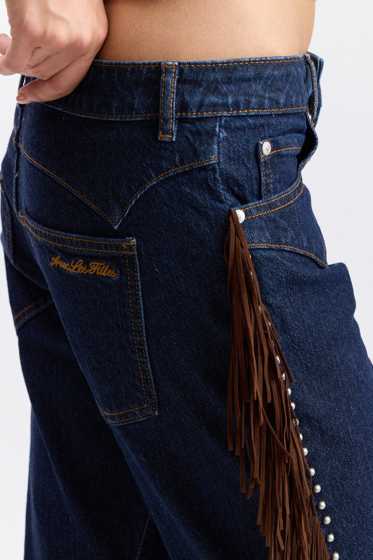 Denim dark wash bootcut jeans with fringe and a low-rise waist - Shop cute fringe denim jeans by Avec Les Filles.
