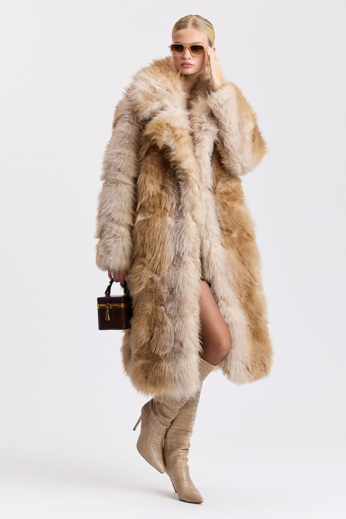 Tan fur coat with a wide collar and button front. Shop designer women's cute brown long coats by Avec Les Filles.