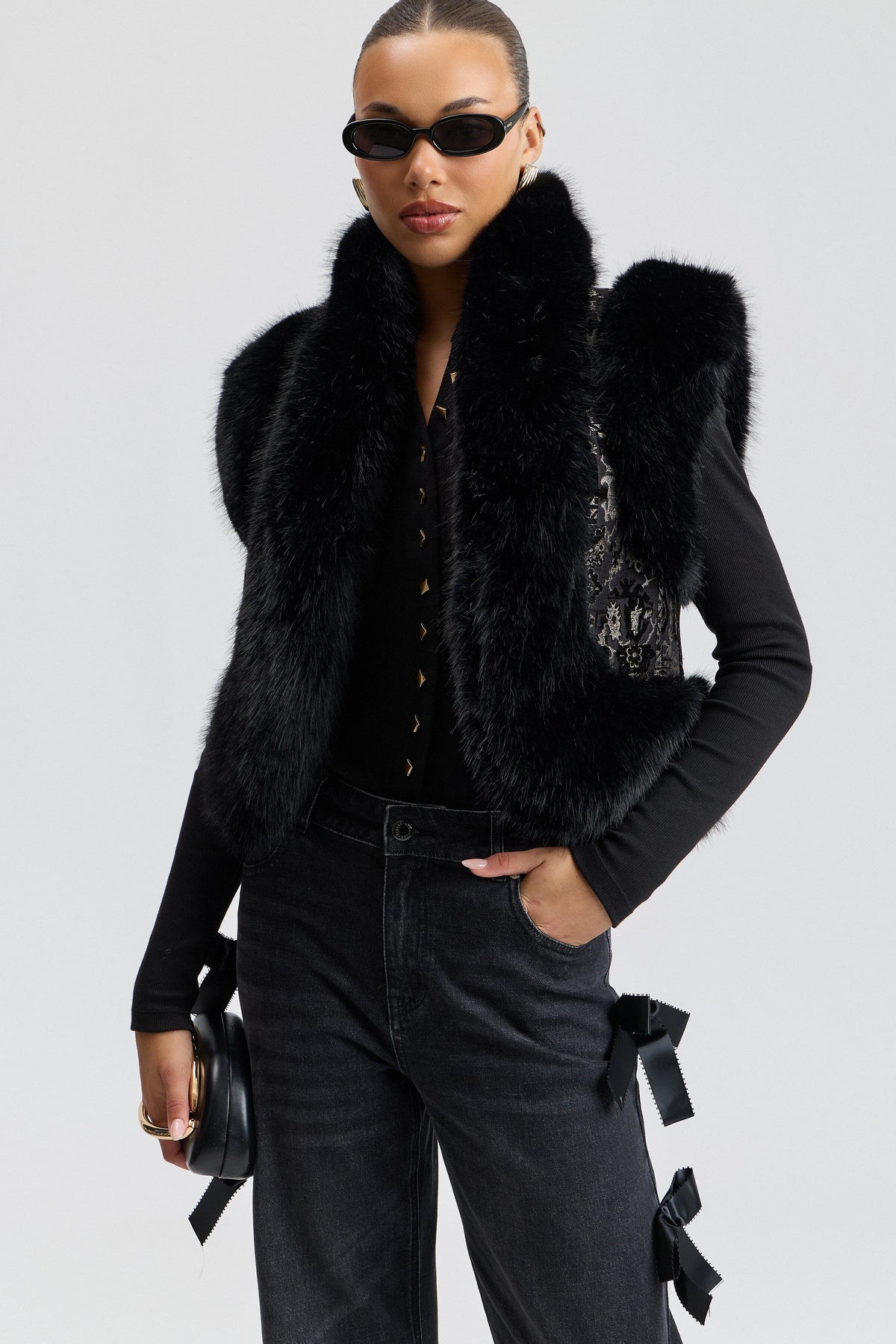 Black fur faux fur vest has a cropped length and an open front - Shop faux fur vests for women by Avec Les Filles.