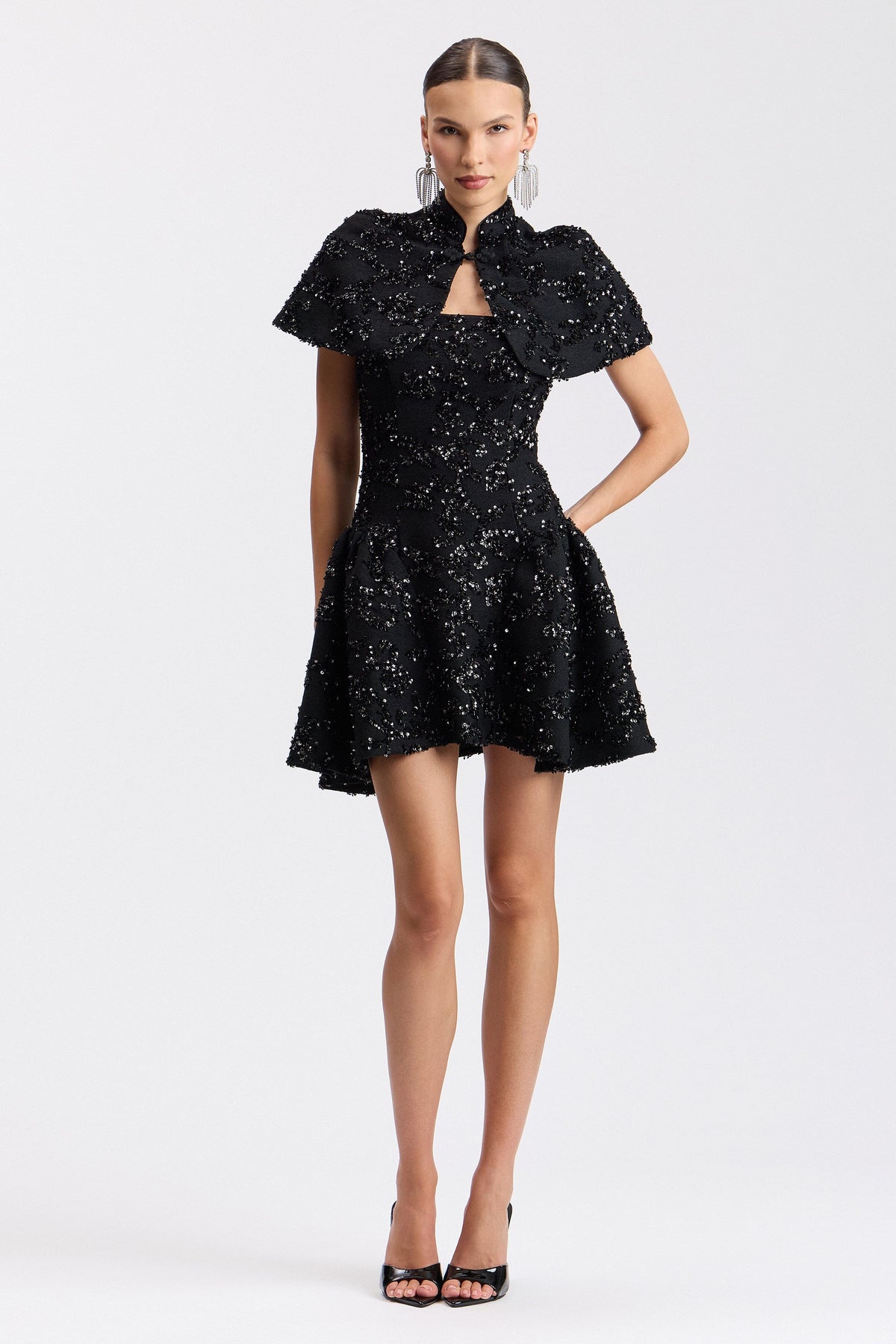 Embellished fit-and-flare black mini dress with short sleeves and mock neck. Shop black mini dresses by Avec Les Filles.
