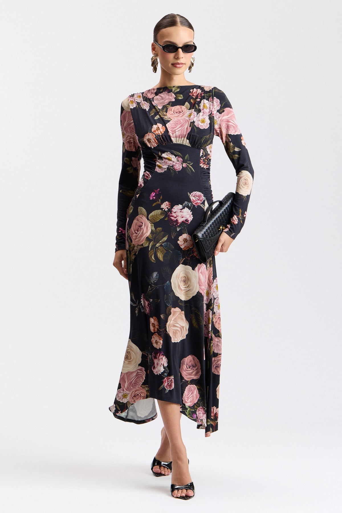 Shirred-shoulder black floral midi dress with cowl neck and high-low hem. Shop women's midi dresses by Avec Les Filles.