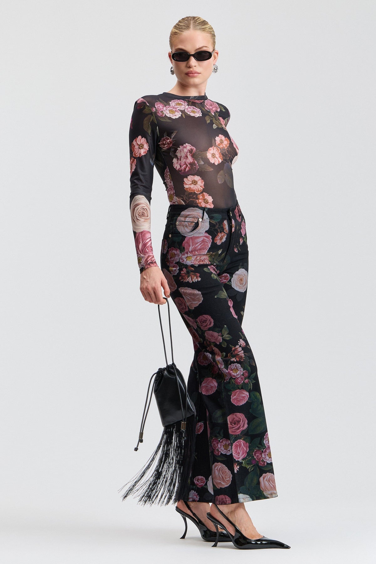 Black denim flower jeans with a high-rise waist and pockets. Shop women's wide leg denim jeans by Avec Les Filles.