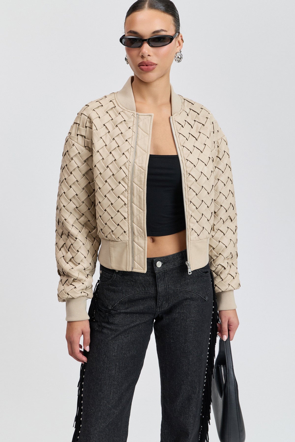 Cream woven bomber womens faux leather jacket with a rib-knit collar. Shop faux leather jackets by Avec Les Filles.
