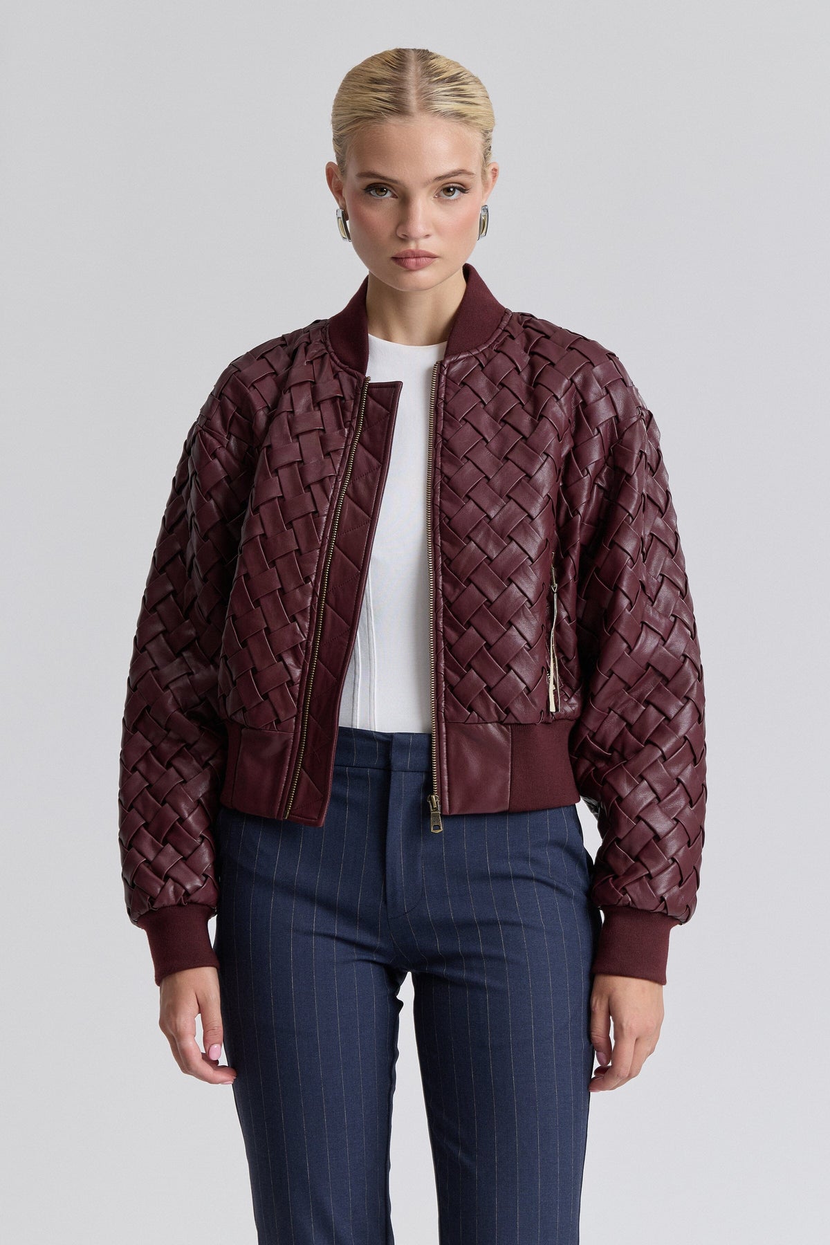 Woven red faux leather jacket with a zip front and long sleeves - Shop women's bomber jackets by Avec Les Filles.