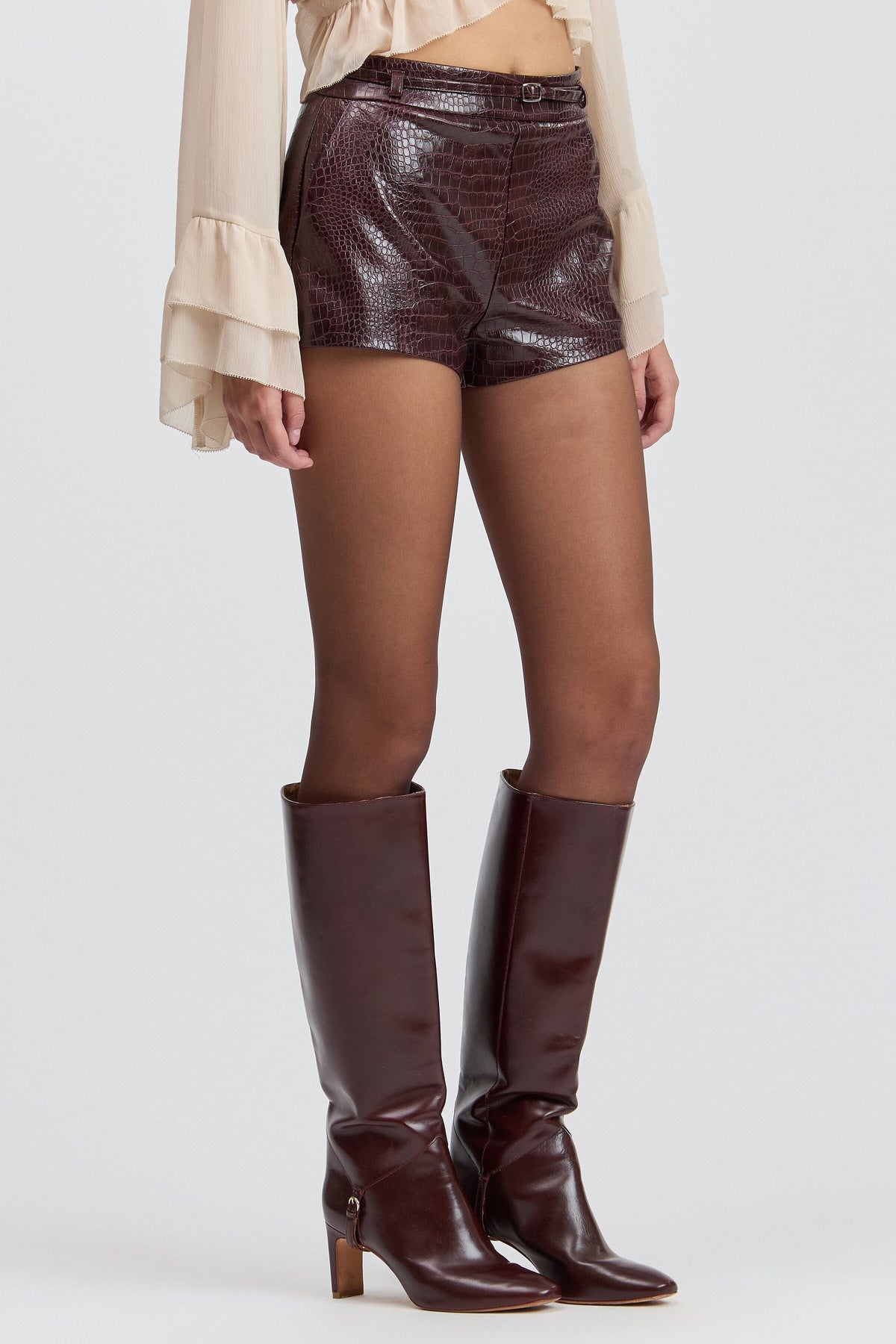 Croc-embossed belted leather micro shorts with a high-rise waist. Shop womens leather shorts by Avec Les Filles.