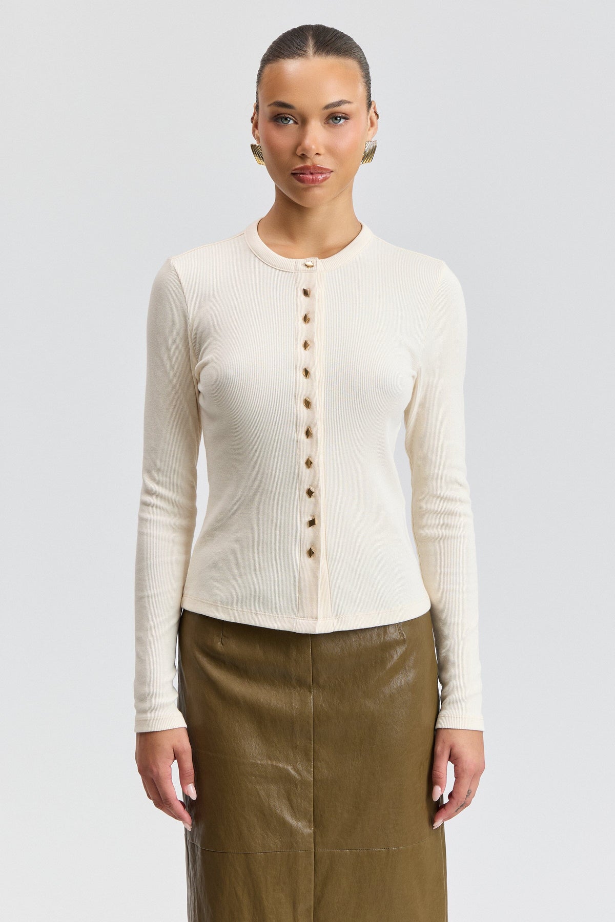 Long sleeve crew neck white t-shirt in stretch cotton jersey with a button front. Shop white T-shirts by Avec Les Filles.