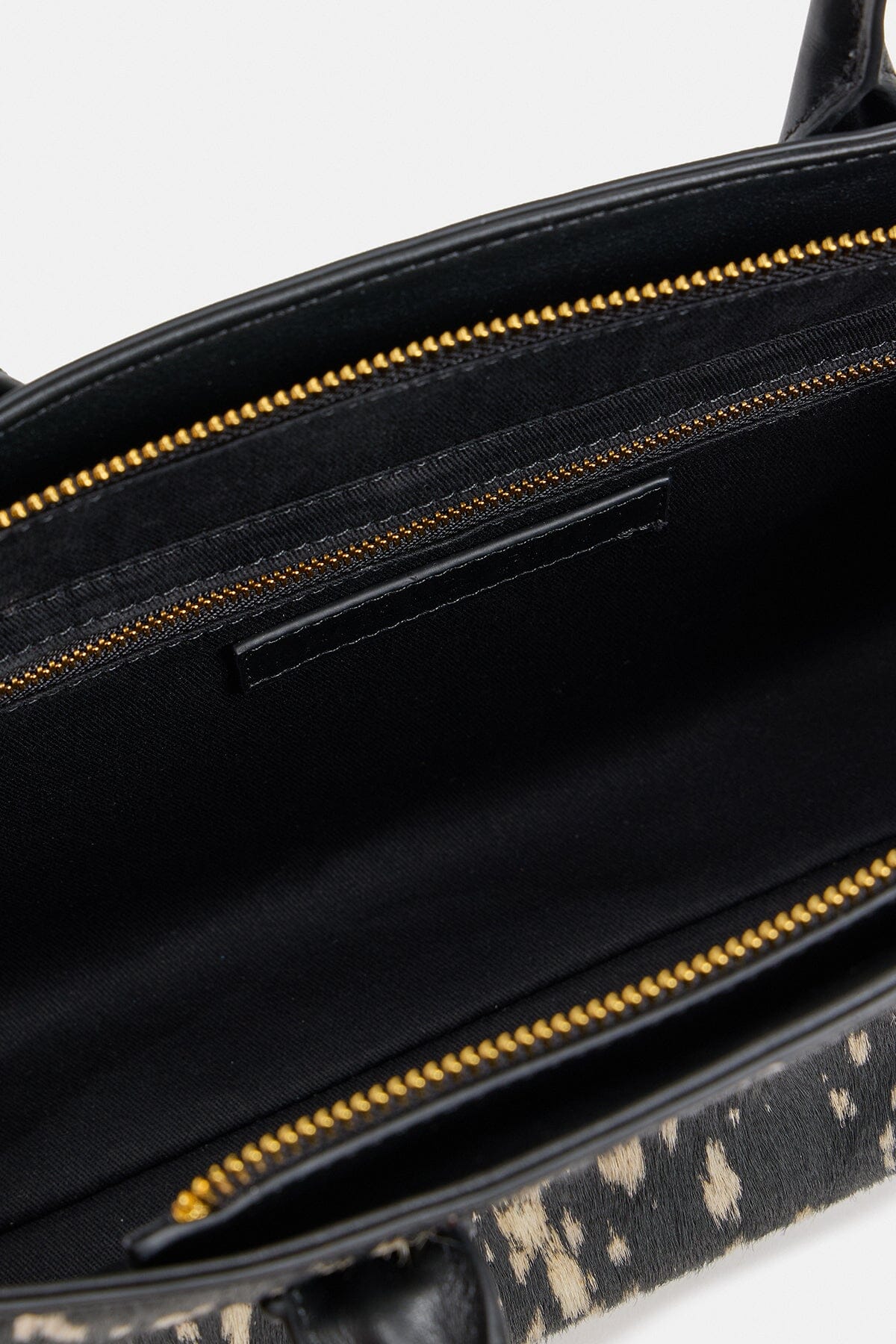 Black and white pony hair purse is crafted from genuine leather - Shop women's cute bags by Avec Les Filles.