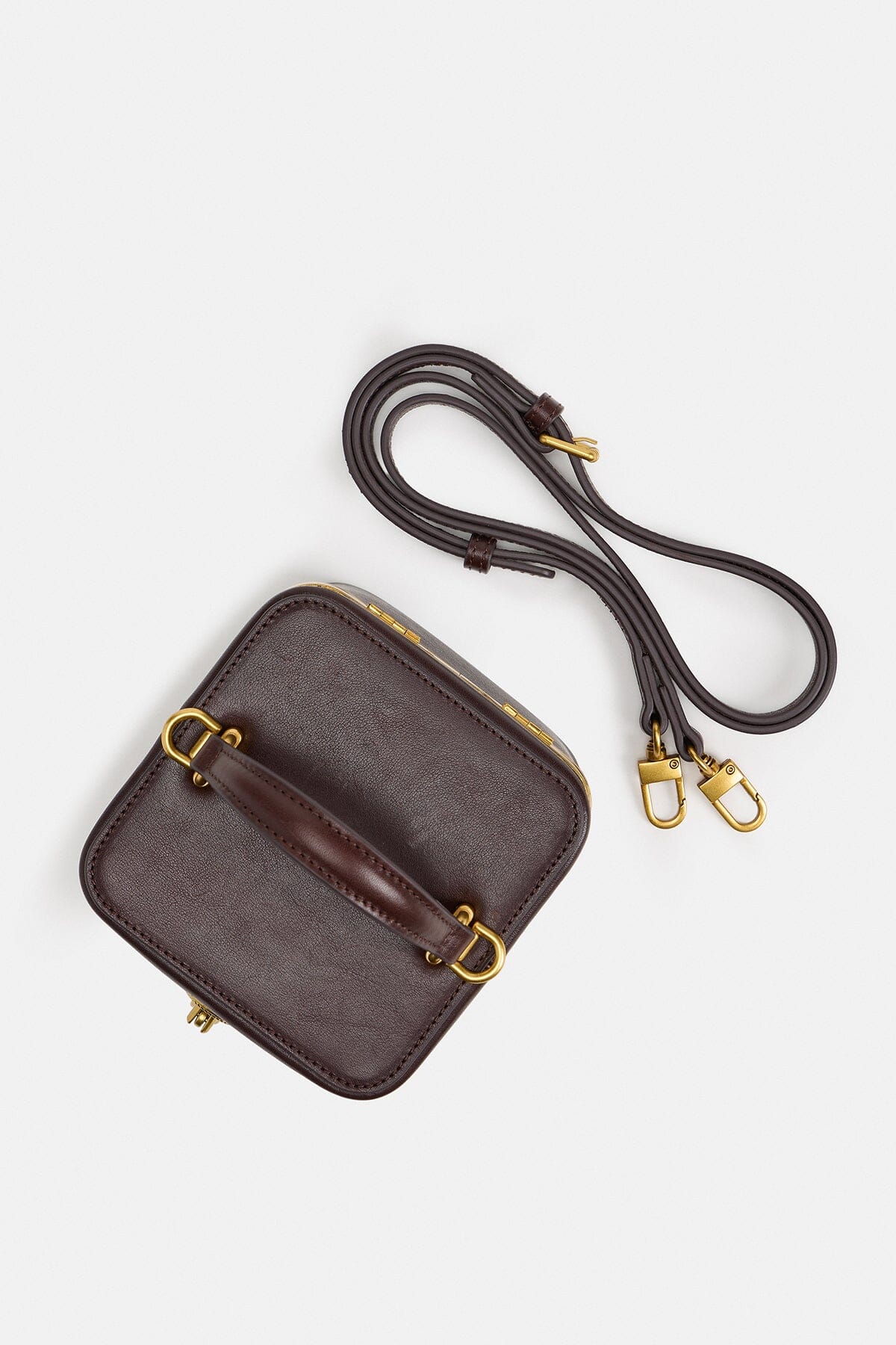 Brown mini vanity purse in genuine leather with detachable adjustable shoulder strap by Avec Les Filles.